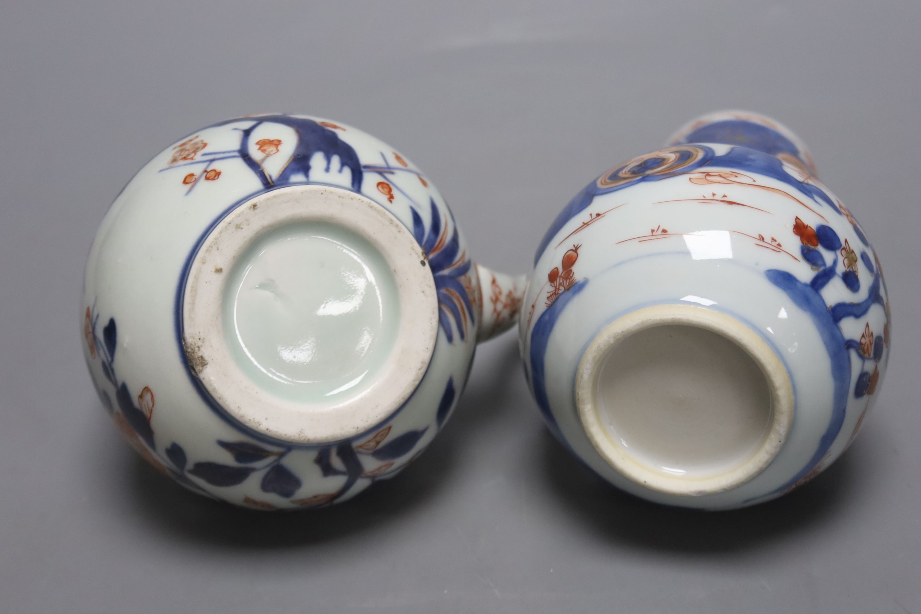 A pair of 18th century Chinese Imari style dishes, diameter 22.5cm, together with a similar chocolate pot and an 18th century Japanese Arita teapot, associated cover